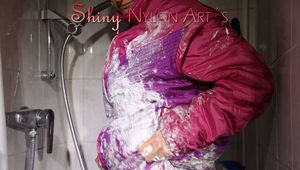 Sexy Sonja wearing a sexy purple downsuit foaming herself with shaving cream (Pics)