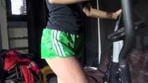 Watching sexy Sandra during her workout wearing a sexy green shiny nylon shorts and a black top (Video)