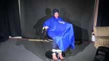 Watching Sonja sitting on a hairdresser`s chair wearing sexy blue shiny nylon rainwear with a raincape being tied, gagged and hooded with ropes and a clothgag (Video)