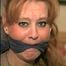41 Yr OLD RED HEADED FAMOUS FASHION MODEL IS MOUTH STUFFED, CLEAVE GAGGED, HOG-TIED & TOE-TIED WEARING NYLON STOCKINGS PT 6 (D57-11)