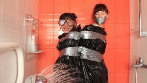 Anni Bay and Dakota - the pair in trash bags in the shower