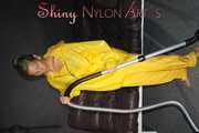 Watching sexy Sandra wearing a hot yellow shiny nylon rainwear combination during her housework (Pics)