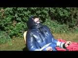 03:45 Min. video with Julia tied and gagged in a shiny down jacket