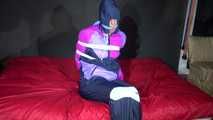 Have a look on sexy Pia wearing a supersexy blue/purple/pink rainwear combination being tied and gagged with ropes and a cloth gag (Video)