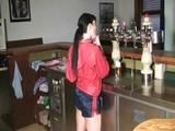 Jill in a bar wearing a sexy blue/red shiny nylon shorts and a red rain jacket (Video)