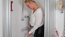 Blonde Frida takes a shower in her white shirt and black glossy pants