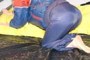 ***HOT HOT HOT*** SONJA wearing a sexy oldschool blue/red shiny nylon down suit while preparing her bed (Pics)