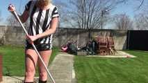 Watching Pia sweeping the terrace wearing a sexy black shiny nylon shorts, a striped top and black rubber boots (Video)