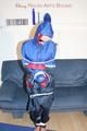 Jill tied, gagged and hooded wearing shiny nylon rainwear (Pics)