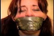 23 YR OLD REAL ESTATE BROKER IS MOUTH STUFFED WITH A SPONGE, WRAP TAPE GAGGED, GAG TALKING, RAG STUFFED IN MOUTH AND TIGHTLY HANDGAGGED  (D74-15)
