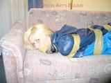 Archive girl tied and gagged with tape and rope wearing shiny nylon rainwear in blue (Pics)