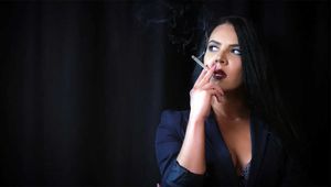 Alluring wonder woman Tanya enjoying a white 120mm cigarette