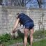 Sexy Sandra wearing a sexy darkblue shiny nylon shorts and a blue downvest during her gardening work (Video)