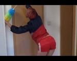 Sonja cleaning up the corridor wearing a very hot red shiny nylon shorts and an oldschool red/blue rain jacket (Video)