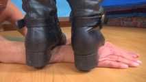 Isabella, hands under boots