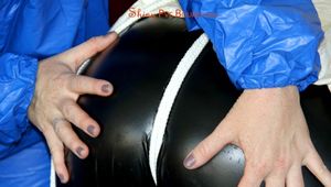Sophie tied and gagged by Jill wearing a shiny black/white PVC combination (Pics)