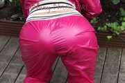 Watching Aiyana wearing supersexy pink shiny nylon rainwear while planting flowers in the garden (Pics)