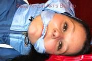 Lucy tied and gagged with a rope and a gag on a red sofa wearing an oldschool blue downwear combination (Pics)