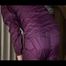 Pia wearing a purple rainwear tidying up the rainwear cupboard (Video)