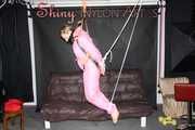 Sexy SANDRA wearing a hot pink oldschool downbib and a down jacket being tied and gagged with ropes and a clothgag hanging on the ceiling  Part 1 of 2 (Pics)