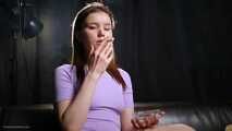 18 aged girl is smoking two strong cork cigarettes