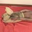 Video: Helpless asian girl in a hogtie struggling on the couch, Wearing only pantyhose, gag and ropes