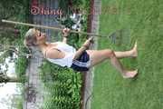 Watching sexy Sandra wearing a oldschool blue shiny shorts and a top while gardening outside (Video)