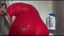 Sonja tied and gagged in a shower cabine with cuffs wearing a supersexy red shiny nylon jumpsuit (Video)