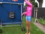 Watch Sandra enjoying the Summer in her shiny nylon Shorts in the Garden