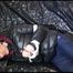 Mara tied, gagged and hooded on a sexy black covered sofa wearing a supersexy black down jacket and rain pants (Video)