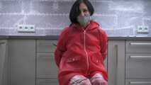 Miss Amira in red nylon rain gear and tranparent rain suit get´s bouind and gagged