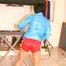 SEXY ENNI wearing a hot red shiny nylon shorts and a lightblue shiny nylon rain jacket during ironing the shirt of her boyfriend (Pics)