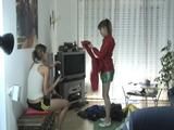Leonie and Lea trying on different shiny nylon clothes (Video)
