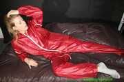 Watch Pia enjoying her shiny nylon Oldschool Rainwear in her shiny nylon Bedsheets