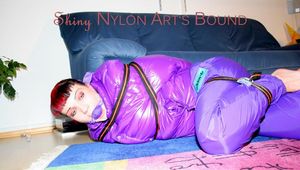 Jill tied and gagged with webbing load restraint assembly on the floor wearing a sexy purple down jacket and a rain pants (Pics)