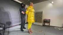 Ms Ungeniert tied, gagged and hooded in shiny nylon yellow Downjacket