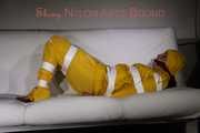Watching Pia being tied and gagged with tape and a cloth gag wearing sexy yellow shiny nylon rainwear (Pics)