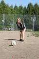 Leonie playing soccer outdoor wearing a sexy black shiny nylon shorts and a sexy black rain jacket (Pics)