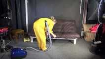 Watching sexy SANDRA vacuum cleaning the studio wearing a sexy yellow rainwear combination (Video)