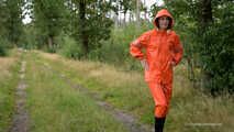 Miss Petra takes a walk in a orange AGU rain suit and rubber boots