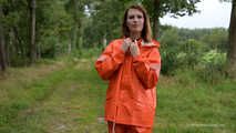 Miss Petra takes a walk in a orange AGU rain suit and rubber boots