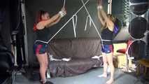 Watching sexy Stella and Sandra both wearing a hot shiny nylon shorts and a top being tied and gagged overhead with ropes and a ballgag (Video)