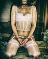 Dolly in white stockings and handcuffed