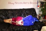 Mara tied, gagged and hooded on a black covered sofa wearing a super hot pink rain pants and a blue rain Jacket (Pics)