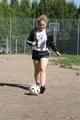 Leonie playing soccer outdoor wearing a sexy black shiny nylon shorts and a sexy black rain jacket (Pics)