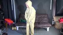 Watching sexy Sandra putting on three rainwear combinations one over the other, hooded (Video)