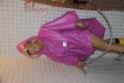Watching Sandra wearing only a pink shiny nylon raincape under the shower playing with the water (Pics)