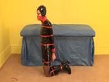 Gothic girl in shiny bondage