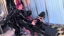 Mistress Tokyo - Heavy rubber Mistress with slave in hard metal bondage