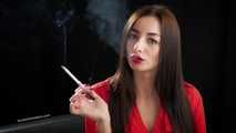 Gorgeous maneater Marina is smoking a 120mm with a short cigarette holder